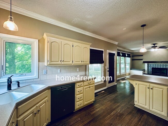 Building Photo - Blue Valley Schools w/ Wood Floors, Finished Basement and a Peaceful, Private Fenced Yard!