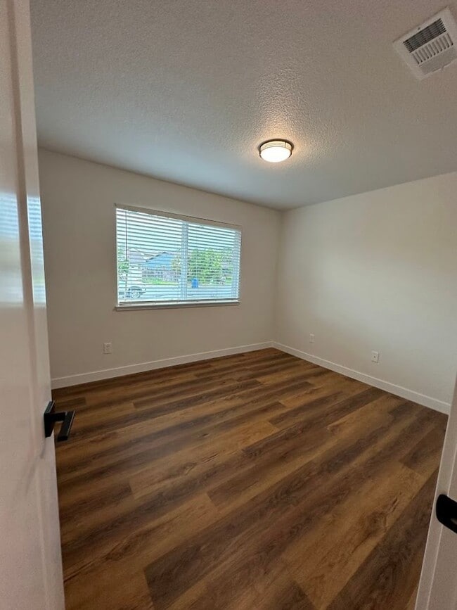 Building Photo - Updated Home with Island Kitchen, LVP Flooring, and Yard Care Included!