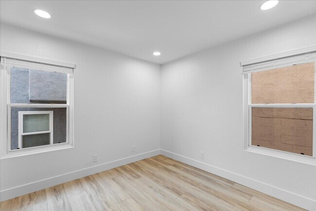 Building Photo - COMPLETELY REMODELED, BRIGHT & AIRY, TRI-LEVEL HOME W/ TOP-FLOOR GREAT ROOM LIVING SPACE, 2-CAR G...