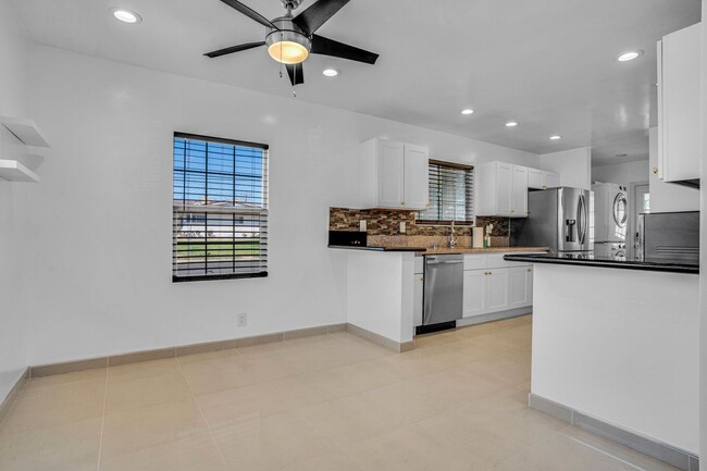 Building Photo - Stunning Remodeled Corner-Lot Home – An En...