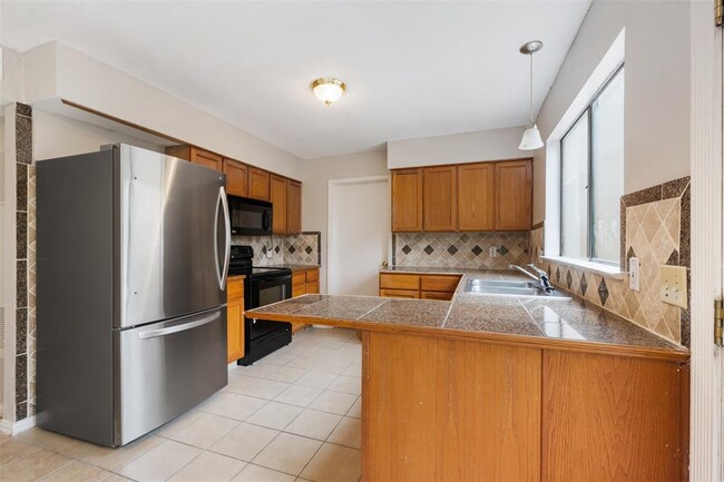 Building Photo - 9520 Quail Village Ln