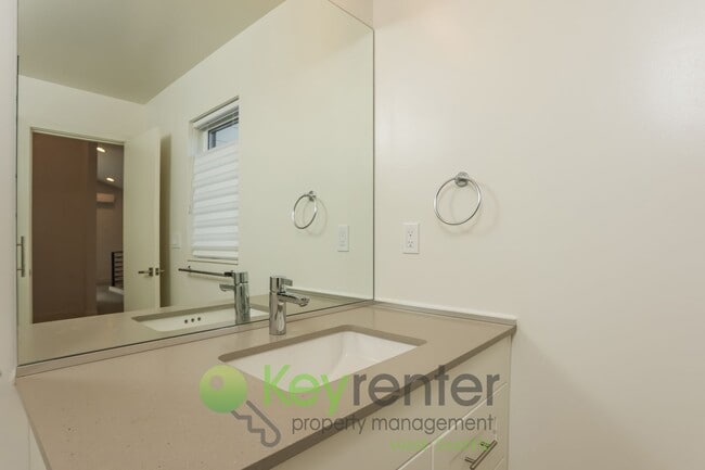 Building Photo - Spacious Living with Balconies, Deck, and Private Yard