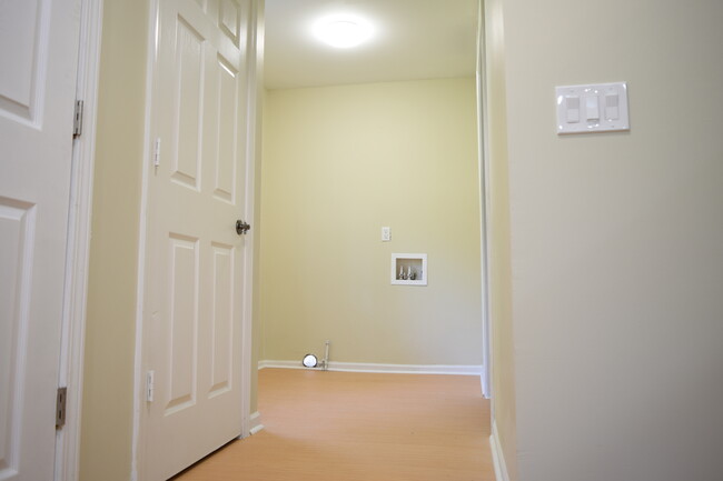 Laundry room with gas dryer hookup and water lines. - 381 Ferry Ave