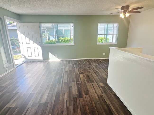 Viewing from stairs towards on the rightfront door and dining area - 5494 Judith St