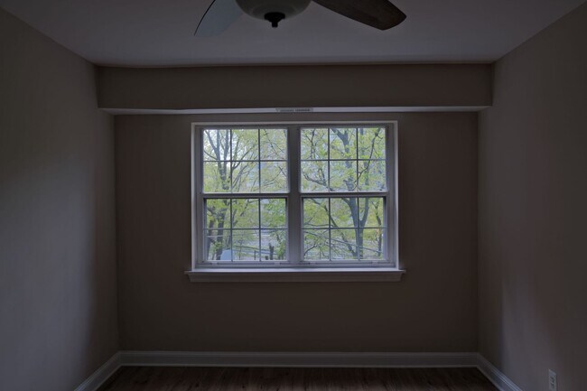 Building Photo - Beautiful corner unit in a secure, all-brick, pet-friendly building