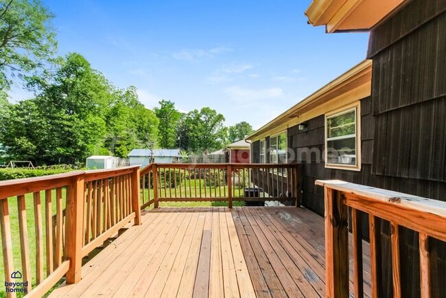 Building Photo - Updated Bungalow with Massive Deck and Fully Fenced Yard!