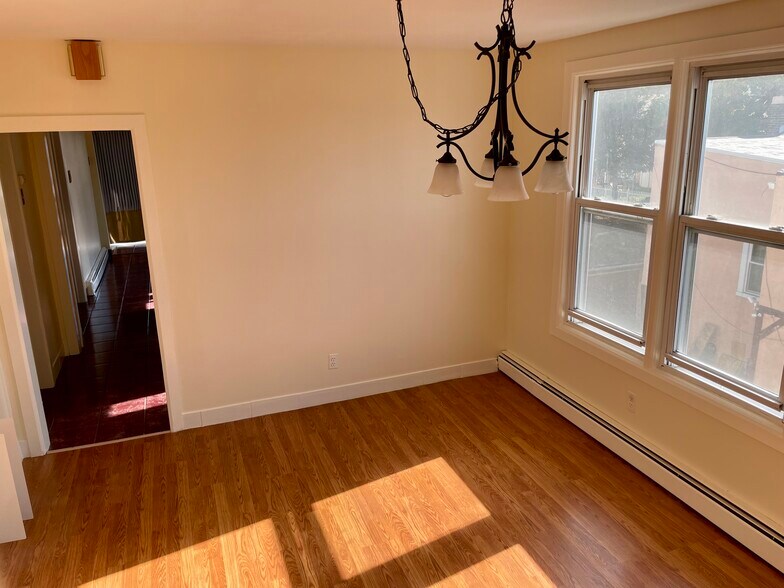Shared living room with two other roommates. - 156 Kearny Ave