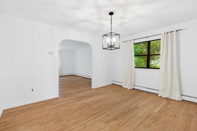 Dining room, offering a versatile space for various dining setups. It has access to the kitchen. - 45 High St