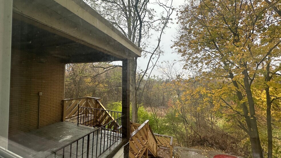 Covered rear porch with ceiling fan and a view. - 2518 Bethel Church Rd