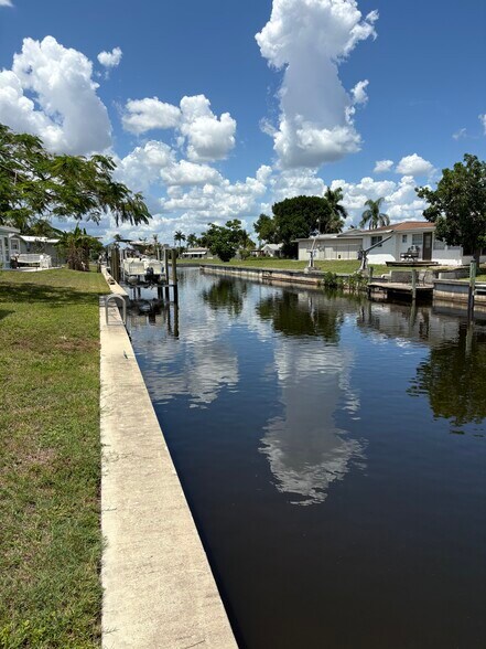 Canal is super close to the River. Any size boat can be kept here. Cleats and ladder in seawall. - 4332 S Atlantic Cir