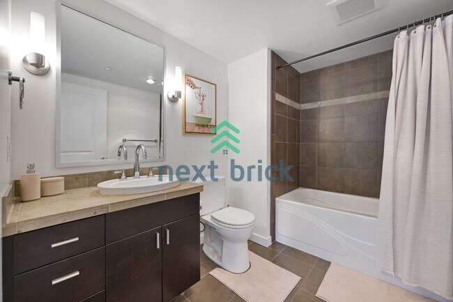 Building Photo - 1 Bedroom | 1 Bathroom | Southeast-Facing High-Floor Condo in Denny Triangle