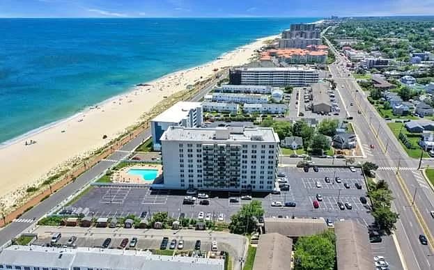 Aerial view of The Anchorage building, parking lot, and pool. Includes 3 parking spots: 1 reserved, - 480 Ocean Ave