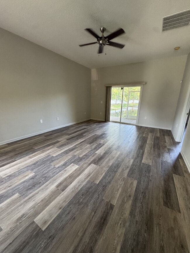 Building Photo - Spacious 4 Bedroom Pond-View Home with Upg...