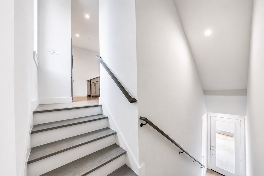 Entryway stairway takes you to main living space and kitchen - 5605 Bryan Pky