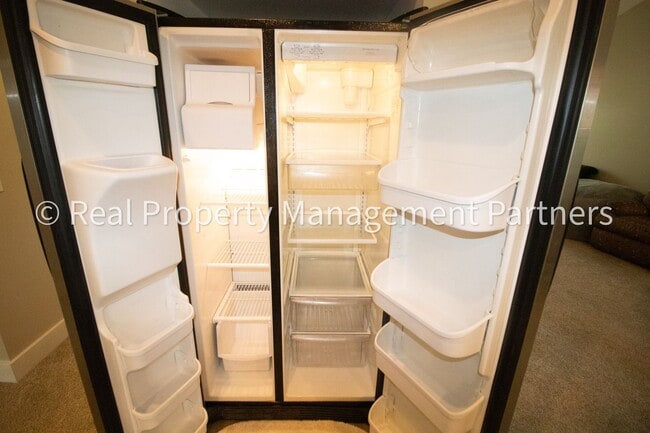 Building Photo - Spacious 3BR Townhome in Lowell | Nature Views & Maintenance-Free Living