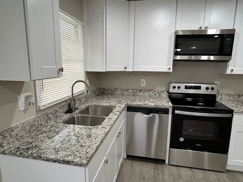 All new appliances and cabinets in the kitchen. - 2245 E Overton Rd
