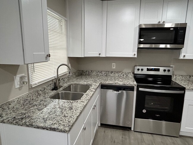 All new appliances and cabinets in the kitchen. - 2245 E Overton Rd
