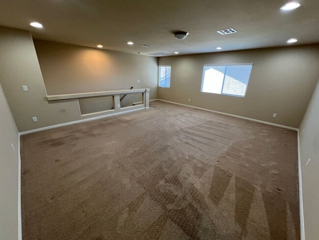 Building Photo - A Fantastic 4 Bedroom Home with the primary Downstairs, in Silverado Ranch