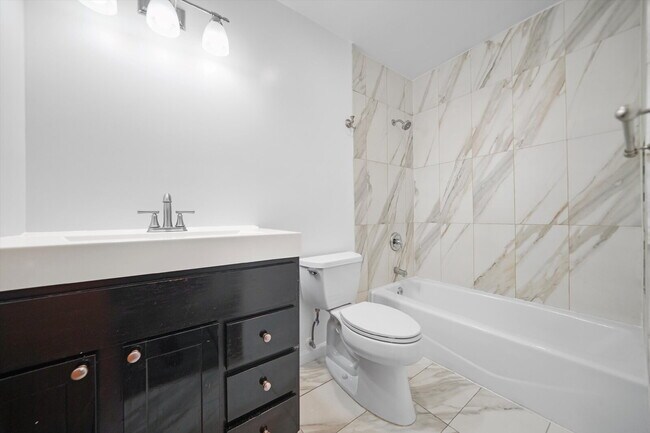 Building Photo - Freshly Renovated 4BR Apartment