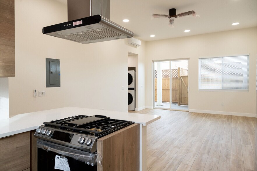 View from kitchen looking into living space with high ceilings. - 4772 Bancroft St