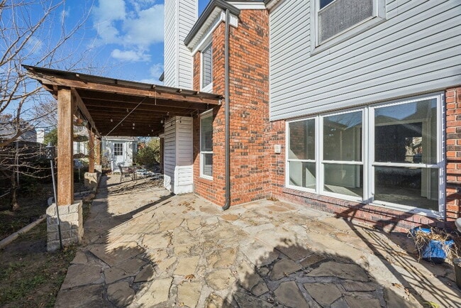 Building Photo - "Spacious 4-Bedroom, 2.5-Bath Living Meets Storybook Backyard Charm!"