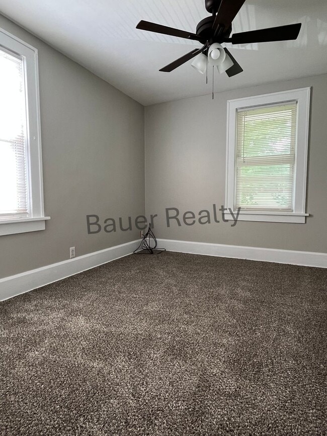 Building Photo - Three bedroom home with two car, detached garage!