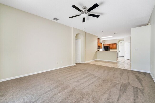 Building Photo - Cozy 4/2 Home Nestled in a Gated Community