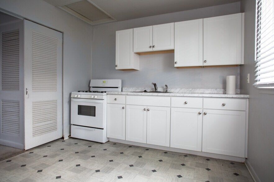 Updated kitchen cabinets and included range oven. - 10631 Saratoga st