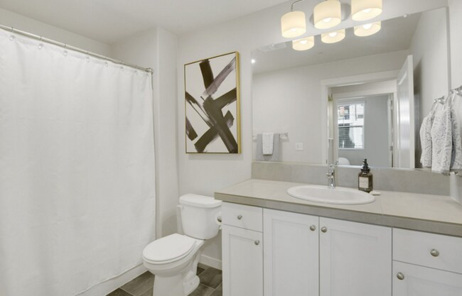Building Photo - Modern Ground-Level Condo in River Terrace...