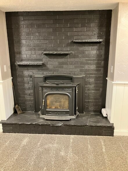 Basement fireplace - 9100 Grandview Ave