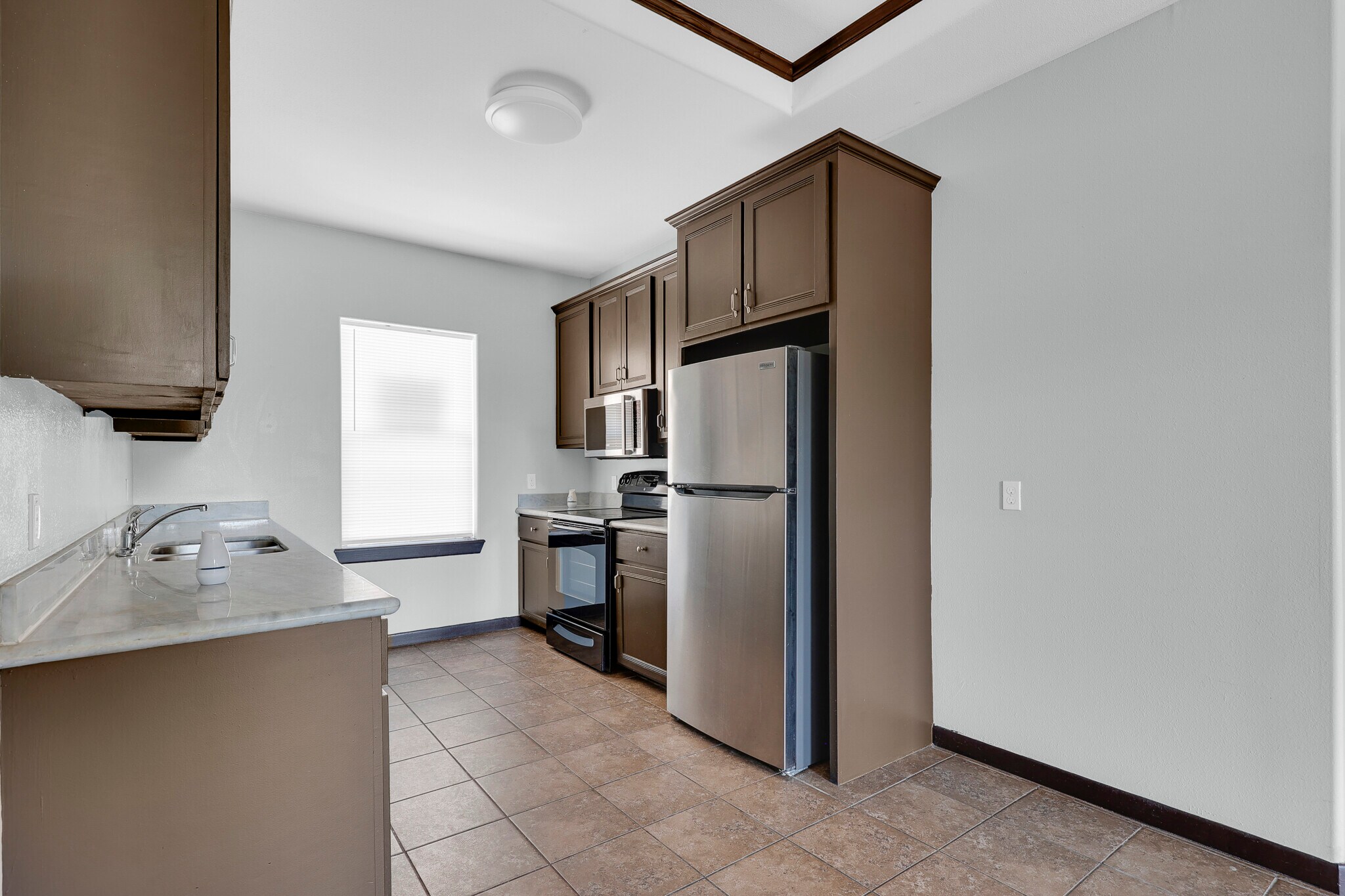 Comes with kitchen appliances. Stove, Microwave and Refrigerator. - 801 E Daffodil