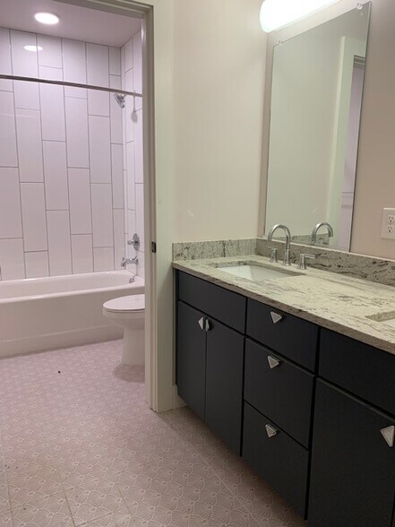 Second full bath. - 210 E Grace St