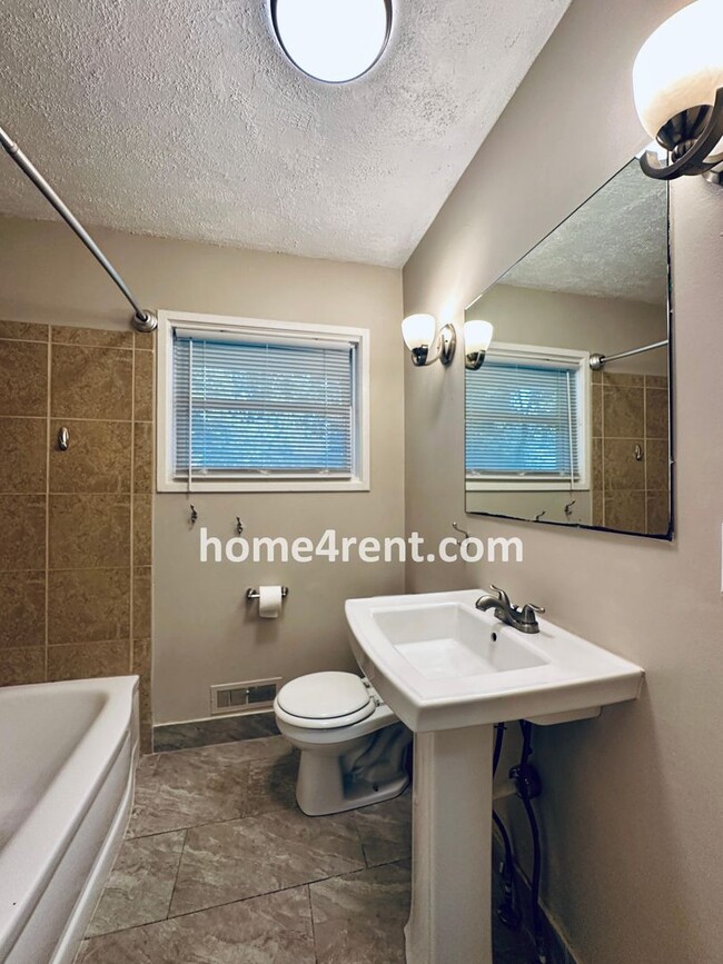 Building Photo - Attractive Prairie Village Ranch w/ FRESH PAINT, Wood Floors, Granite Counters and a Fenced Yard!