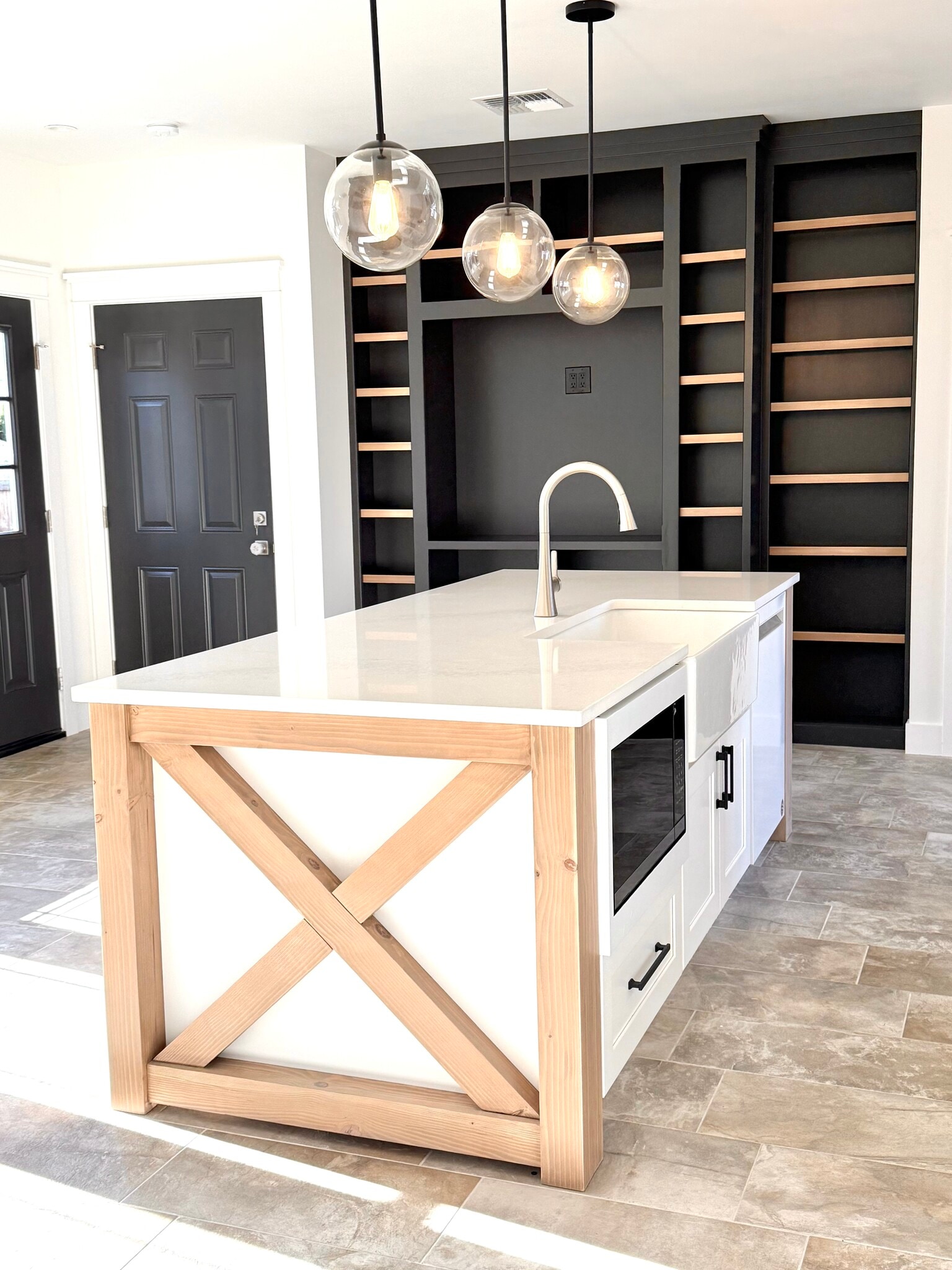 Kitchen, media console , black door on left is loft access and the next is backyard access - 24 Ash St N
