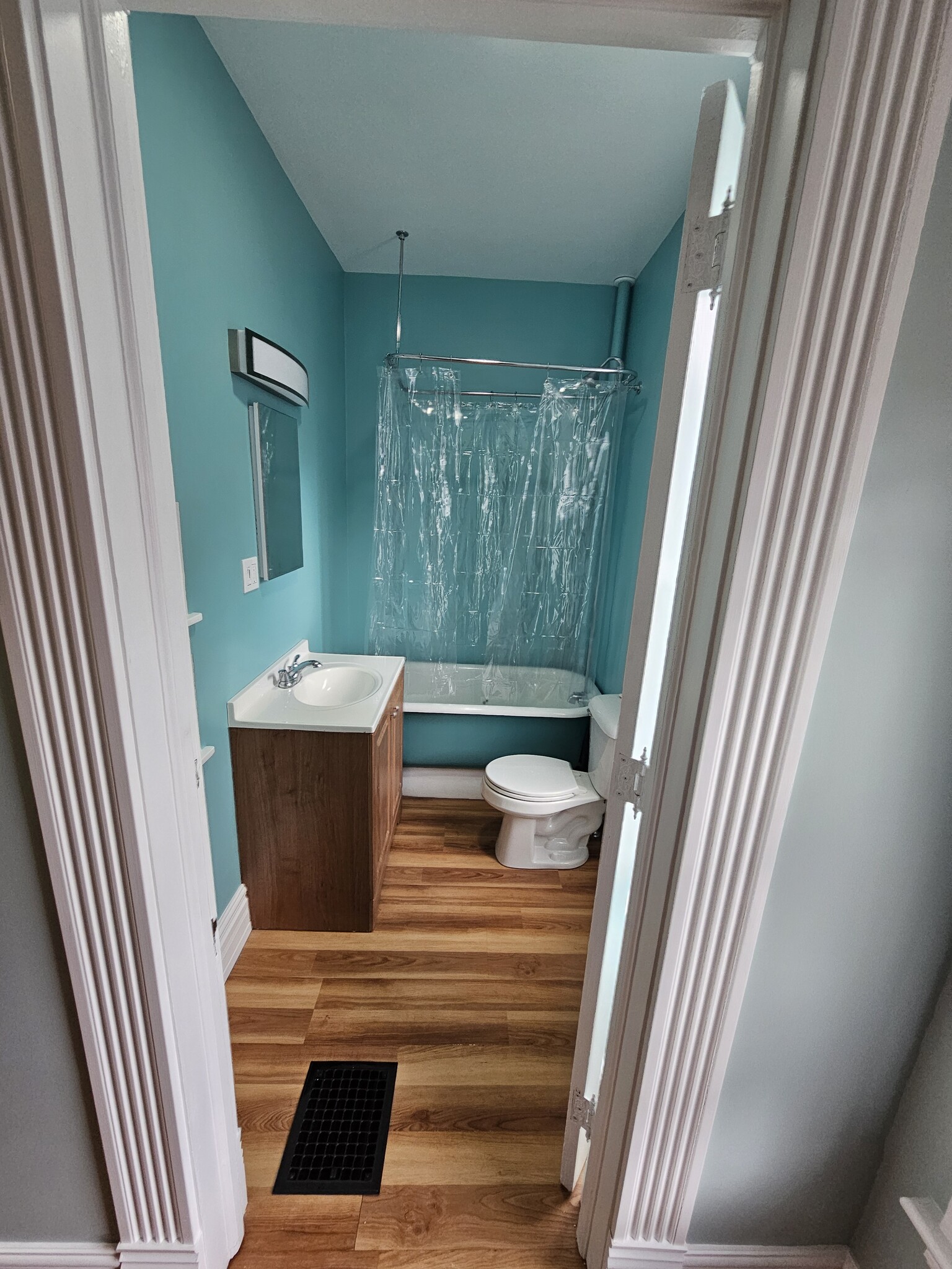 bathroom with vintage pedestal tub/ahower - 113 Packard Ave SE