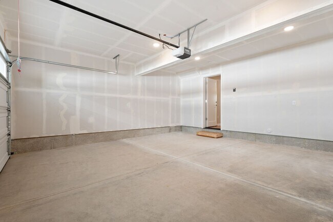 Building Photo - NEW CONSTRUCTION – Stylish 4-Bedroom Townh...