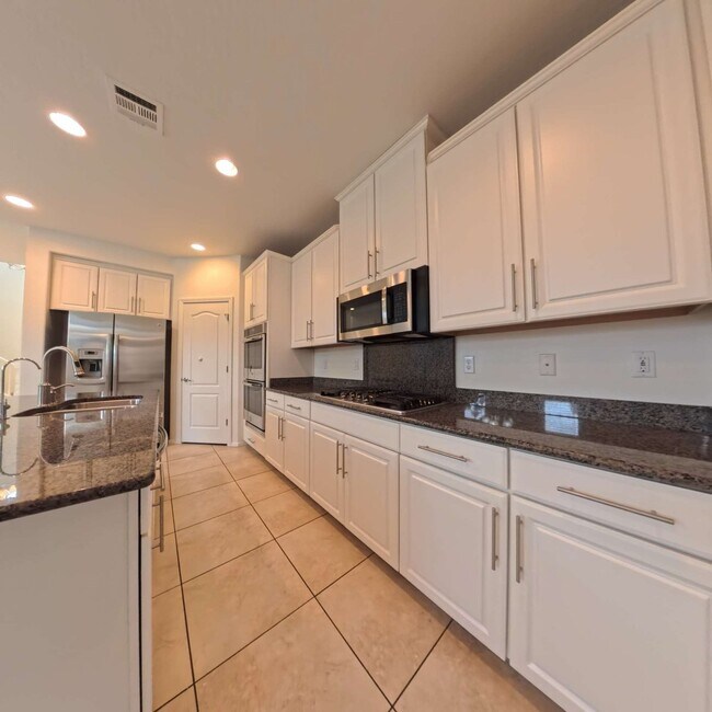 Building Photo - Exceptional Dual Master Residence with Modern Upgrades