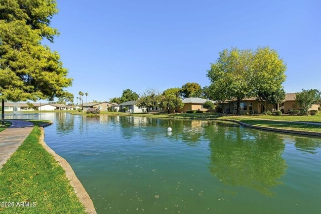 Building Photo - Welcome to this stunning updated 2-bedroom, 2-bathroom home on a lake located in the vibrant comm...