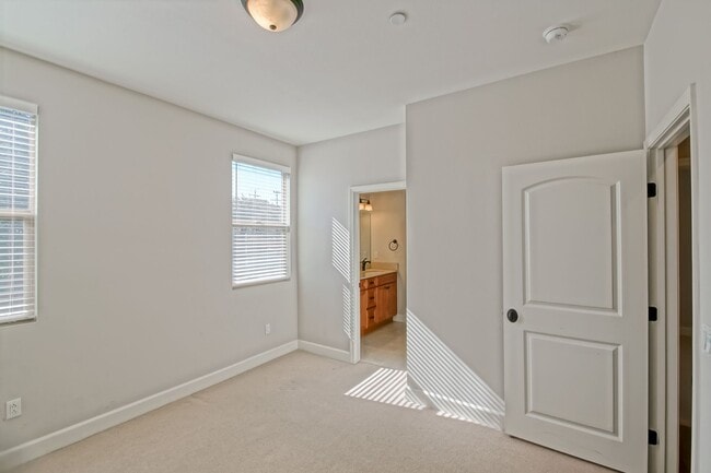 Building Photo - BUILT IN 2019: SPACIOUS & BRIGHT, DETACHED TOWNHOUSE W/ 2-CAR GARAGE & FENCED YARD IN GREAT RESID...