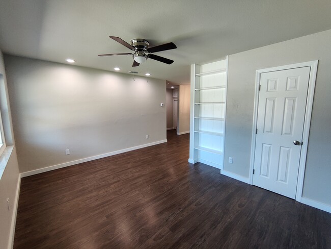 Living Room w/ closet & built-in bookshelf - 1814 26th St W