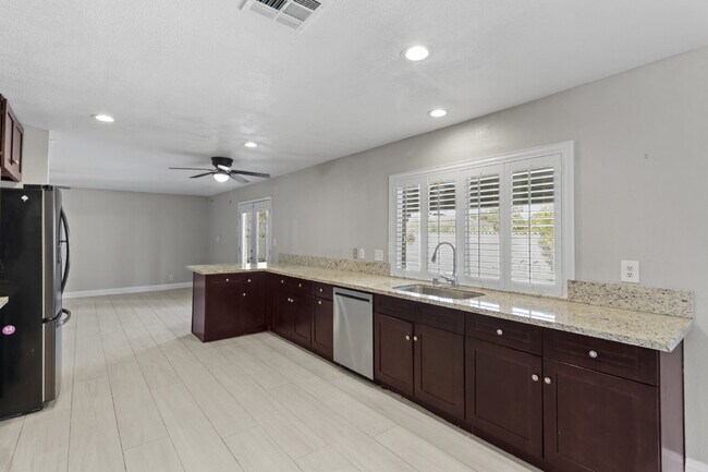 Building Photo - Welcome to your entertainers dream home with solar and pool service included!