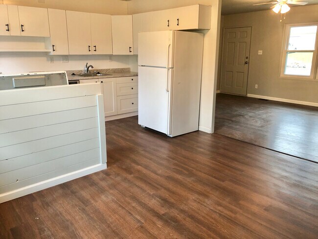 view from dining area into kitchen and living - 1824 Miller Dr