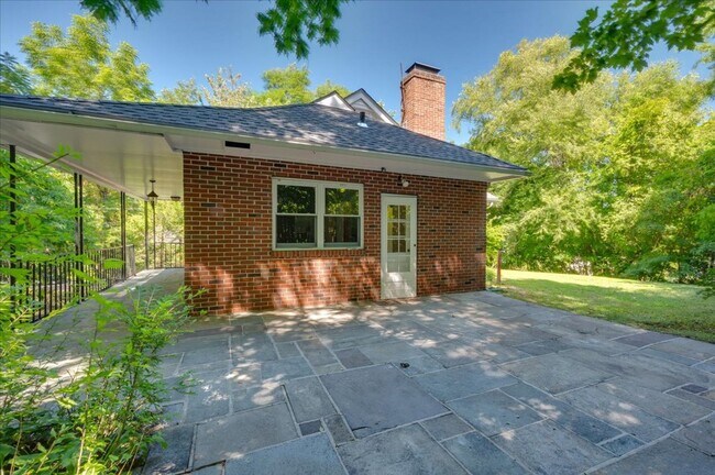 Building Photo - Elegant Multi-Level Brick Residence with Outdoor Oasis