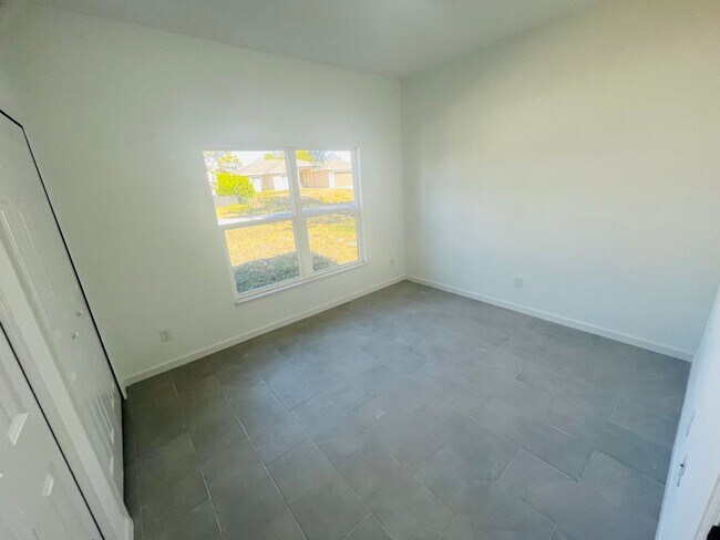 Building Photo - Brand New 2/2/1 - Lehigh Acres