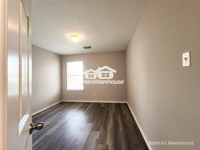 Building Photo - This gem of a townhome is nestled in the w...