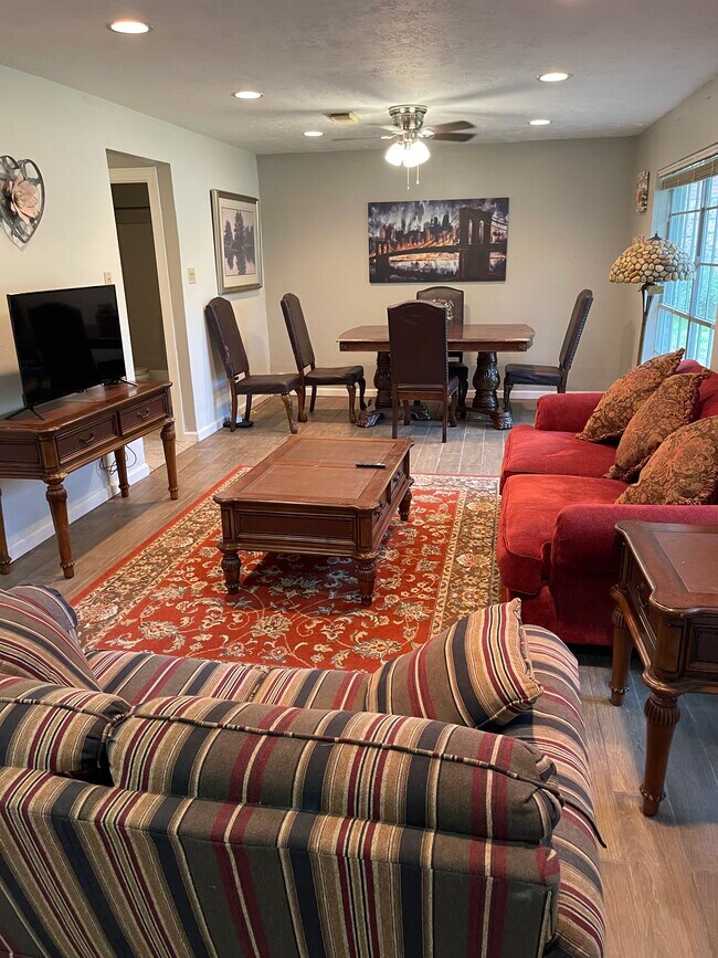 Open concept Living Family room with new Smart TV and echo show Alexa - 2931 Valley Rose Dr