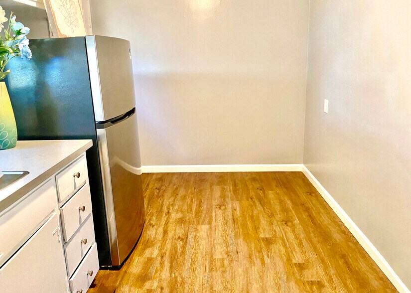 Breakfast nook in kitchen opposite back door - 1114 Stannage Ave