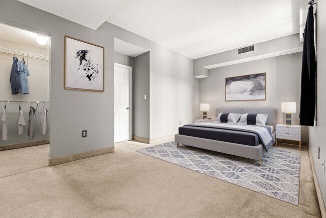 Building Photo - Updated 1BR Condo with Balcony, Garage Parking & Storage Near Commuter Rail