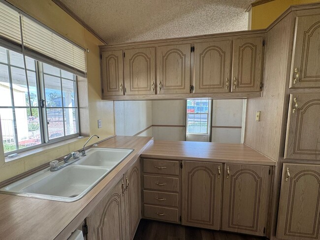 Building Photo - Sunrise Vista -2 Br, 2Ba home with covered carport, fenced yard, storage