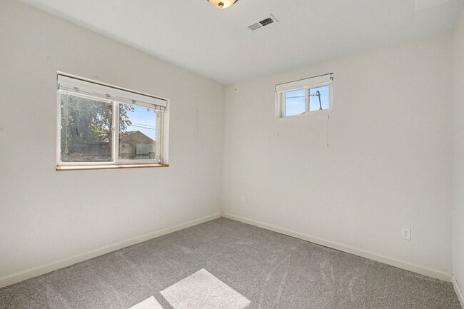 Building Photo - Spacious 4-Bedroom, 2-Bath Home with Large Yard, Garage & Central A/C